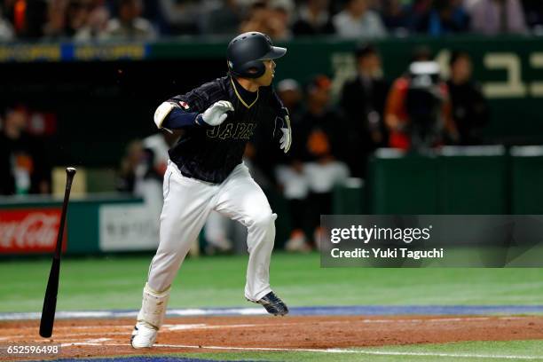 Shogo Akiyama of Team Japan hits a sacrifice fly in the second inning during Game 2 of Pool E of the 2017 World Baseball Classic against Team...