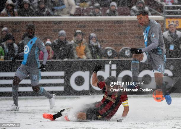 Michael Parkhurst of Atlanta United FC challenges Christian Ramirez of Minnesota United FC for the ball during the first half of the match on March...