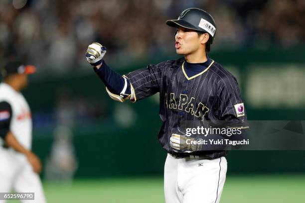 Shogo Akiyama of Team Japan reacts towards the dugout after hitting an RBI single in the third inning during Game 2 of Pool E of the 2017 World...