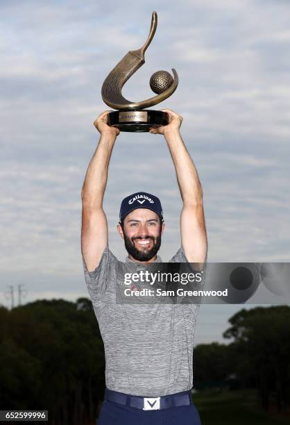 Adam Hadwin of Canada holds the trophy after winning the Valspar Championship during the final round at Innisbrook Resort Copperhead Course on March...