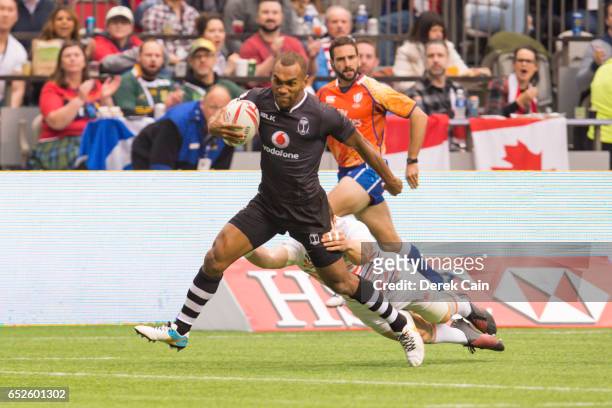 Osea Kolinisau of Fiji is pulled down against England during day 2 of the 2017 Canada Sevens Rugby Tournament on March 12, 2017 in Vancouver, British...