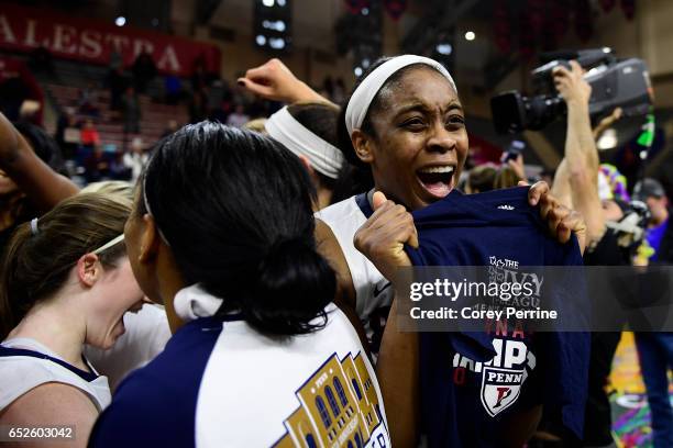 Michelle Nwokedi of the Pennsylvania Quakers is in disbelief after she is handed a tournament t-shirt signifying the win over the Princeton Tigers of...