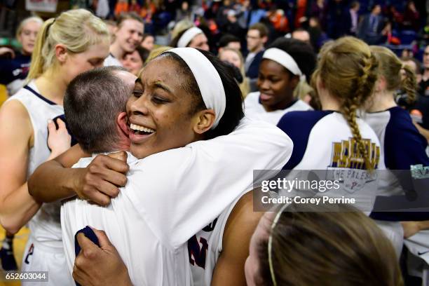 Michelle Nwokedi hugs head coach Mike McLaughlin of the Pennsylvania Quakers after the win against the Princeton Tigers of the Ivy League tournament...
