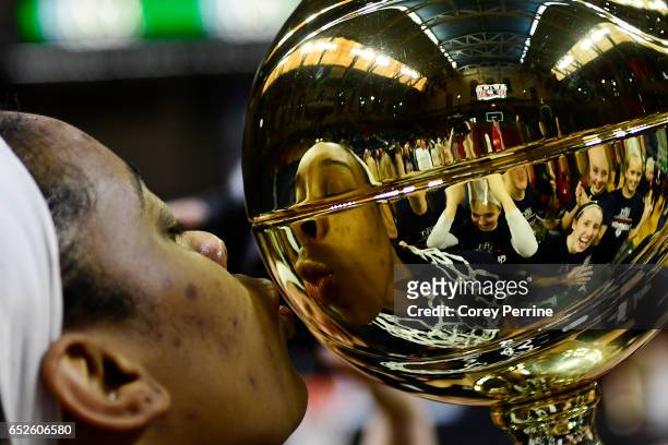 Michelle Nwokedi of the Pennsylvania Quakers goes into kiss the championship trophy after the win against the Princeton Tigers in the Ivy League...