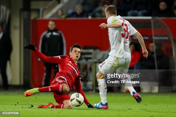 Alfredo Morales of Ingolstadt and Matthias Lehmann of Cologne battle for the ball during the Bundesliga match between FC Ingolstadt 04 and 1. FC...