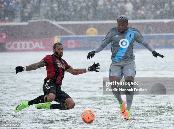 Tyrone Mears of Atlanta United FC challenges Jermaine Taylor of Minnesota United FC for the ball during the first half of the match on March 12, 2017...