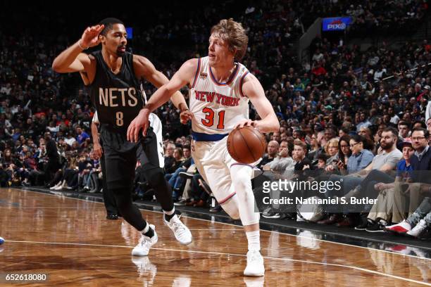Ron Baker of the New York Knicks handles the ball against Spencer Dinwiddie of the Brooklyn Nets during the game on March 12, 2017 at Barclays Center...