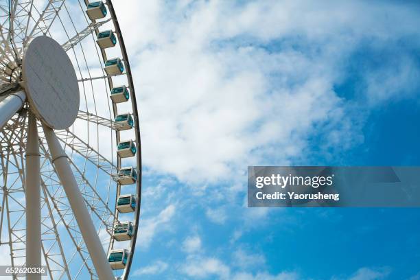 ferris wheel on blue sky,hong kong - ferris wheel foto e immagini stock