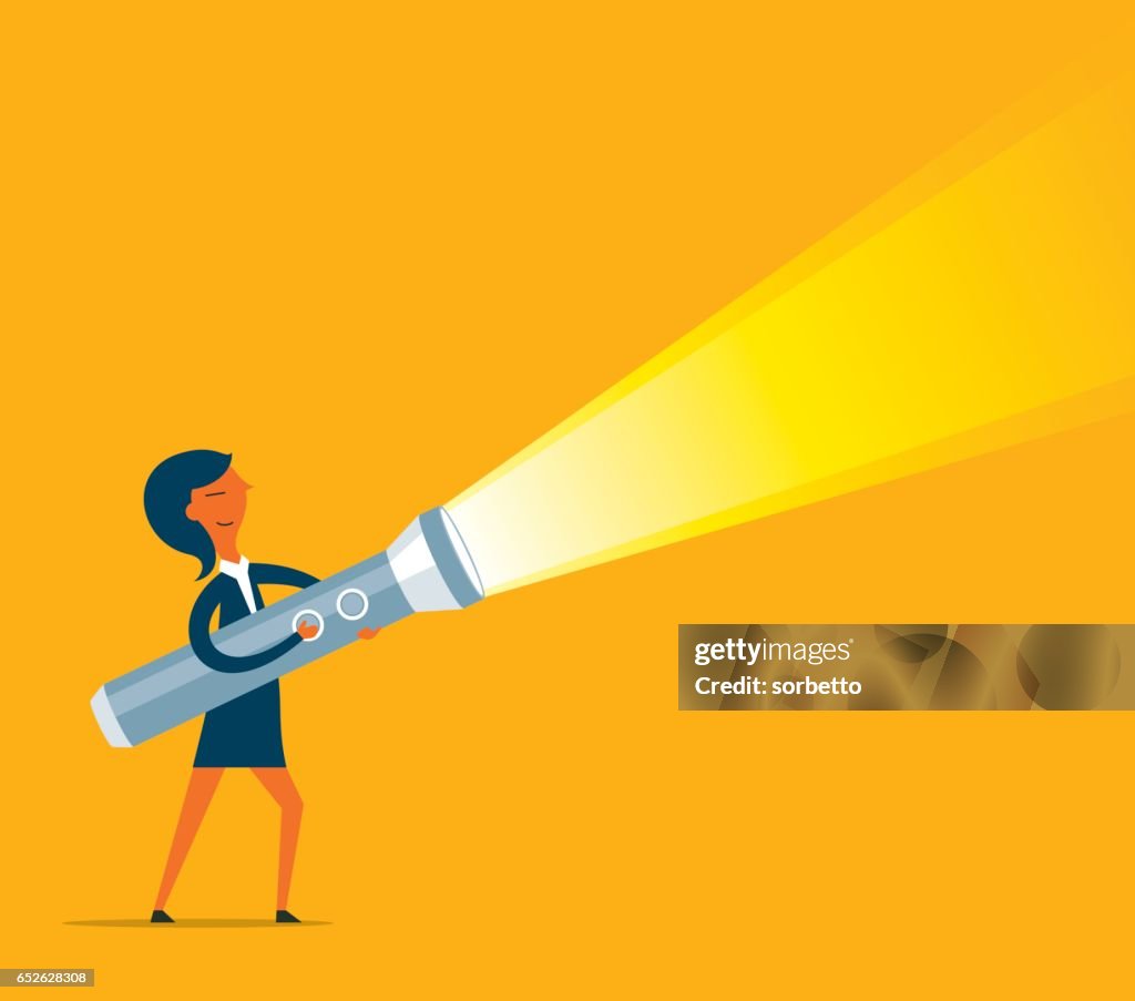 Businesswoman holding a big flashlight