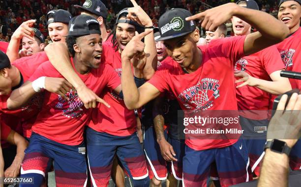 Kobi Simmons, Keanu Pinder and Allonzo Trier of the Arizona Wildcats celebrate after defeating the Oregon Ducks 83-80 to win the championship game of...