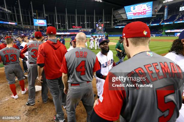 Members of Team USA shake hands with members of Team Canada after Game 6 of Pool C of the 2017 World Baseball Classic on Sunday, March 12, 2017 at...