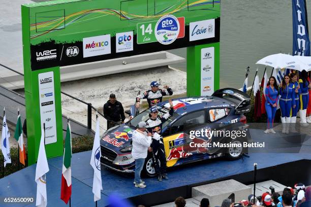 Sebastien Ogier of France and Julien Ingrassia of France celebrate their second position in the overall during Day Three of the WRC Mexico on March...