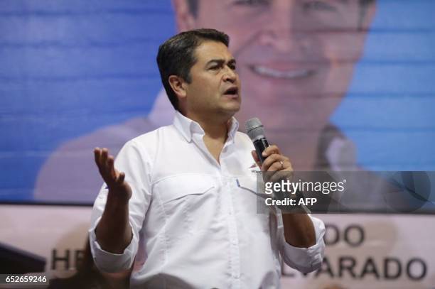 Honduran President Juan Orlando Hernandez declares himself winner in the primary elections of the National party , on March 12, 2017 in Tegucigalpa....