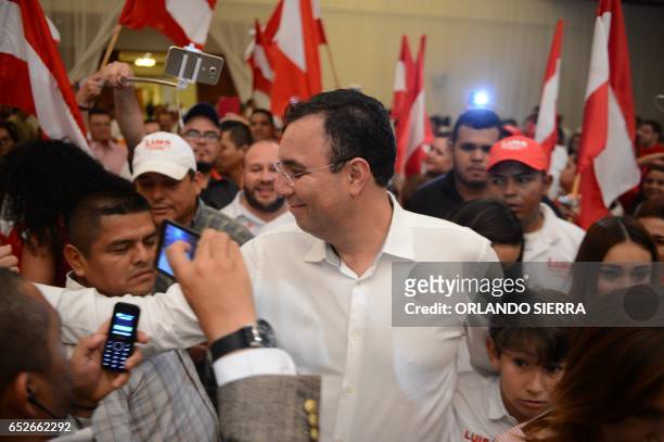 Opposition candidate of the Liberty Party, Luis Zelaya, meets supporters after declaring victory in the primary elections in Tegucigalpa, on March...