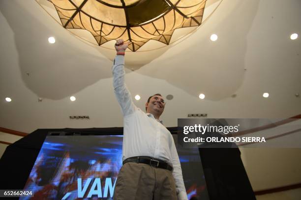 Opposition candidate of the Liberty Party, Luis Zelaya, waves to supporters after declaring victory in the primary elections in Tegucigalpa, on March...