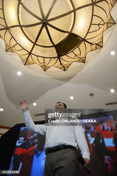 Opposition candidate of the Liberty Party, Luis Zelaya, waves to supporters after declaring victory in the primary elections in Tegucigalpa, on March...