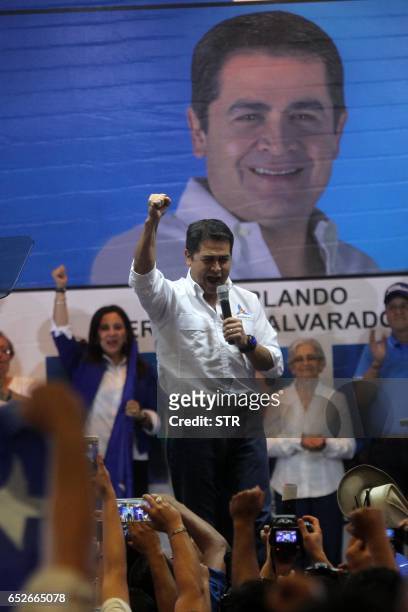Honduran President Juan Orlando Hernandez addresses supporters following victory in the primary elections of the National Party in Tegucigalpa, March...