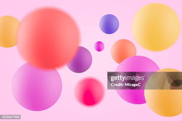 multi-colored balls in mid air - はずむ ストックフォトと画像