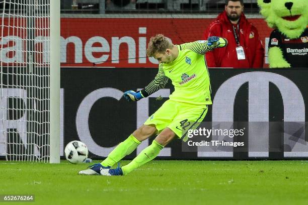 Goalkeeper Felix Wiedwald of Werder Bremen controls the ball during the Bundesliga soccer match between Bayer Leverkusen and Werder Bremen at the...