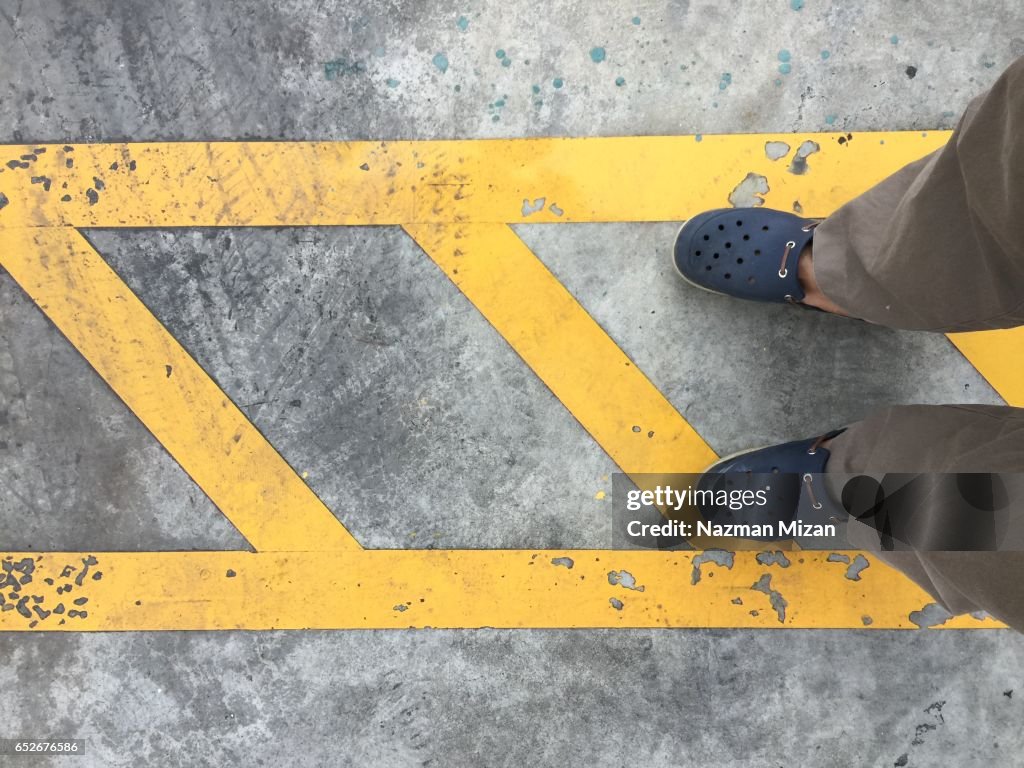 Lines are drawn on the road for directions. A concept of safety.