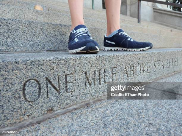 denver "one mile above sea level" step on stairway to colorado state capitol - colorado state capitol building stock pictures, royalty-free photos & images