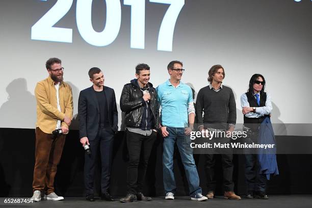 Actor/producer Seth Rogen, actor Dave Franco, actor/director James Franco, author Greg Sestero, and director Tommy Wiseau speak onstage during the...