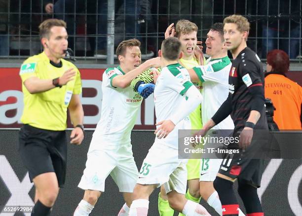 Goalkeeper Felix Wiedwald of Werder Bremen holds the penalty of Oemer Toprak of Leverkusen during the Bundesliga soccer match between Bayer...