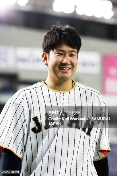 Tomoyuki Sugano of SAMURAI JAPAN looks on during on the practice day during the World Baseball Classic at the Tokyo Dome on March 13, 2017 in Tokyo,...