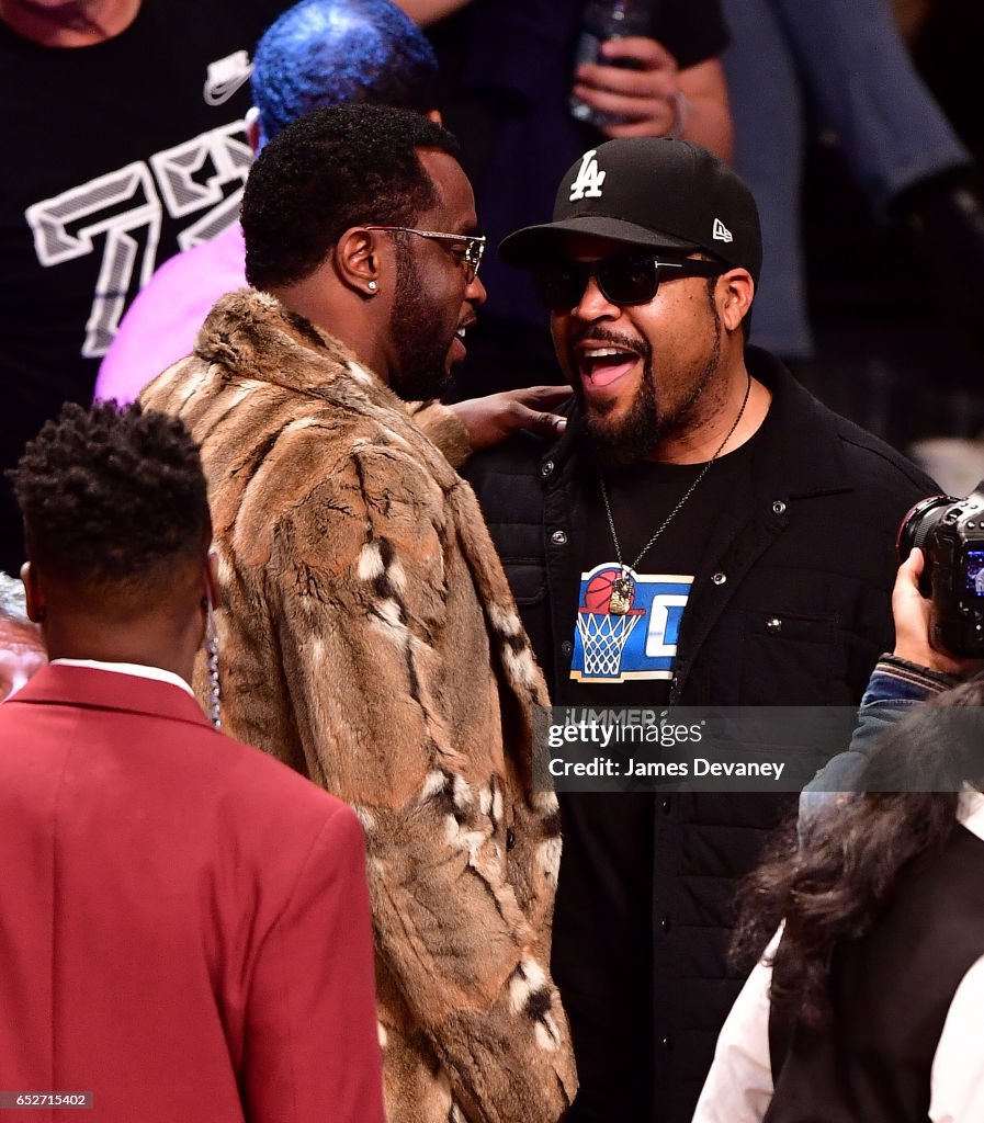 Sean 'Diddy' Combs and Ice Cube attend New York Knicks Vs. Brooklyn