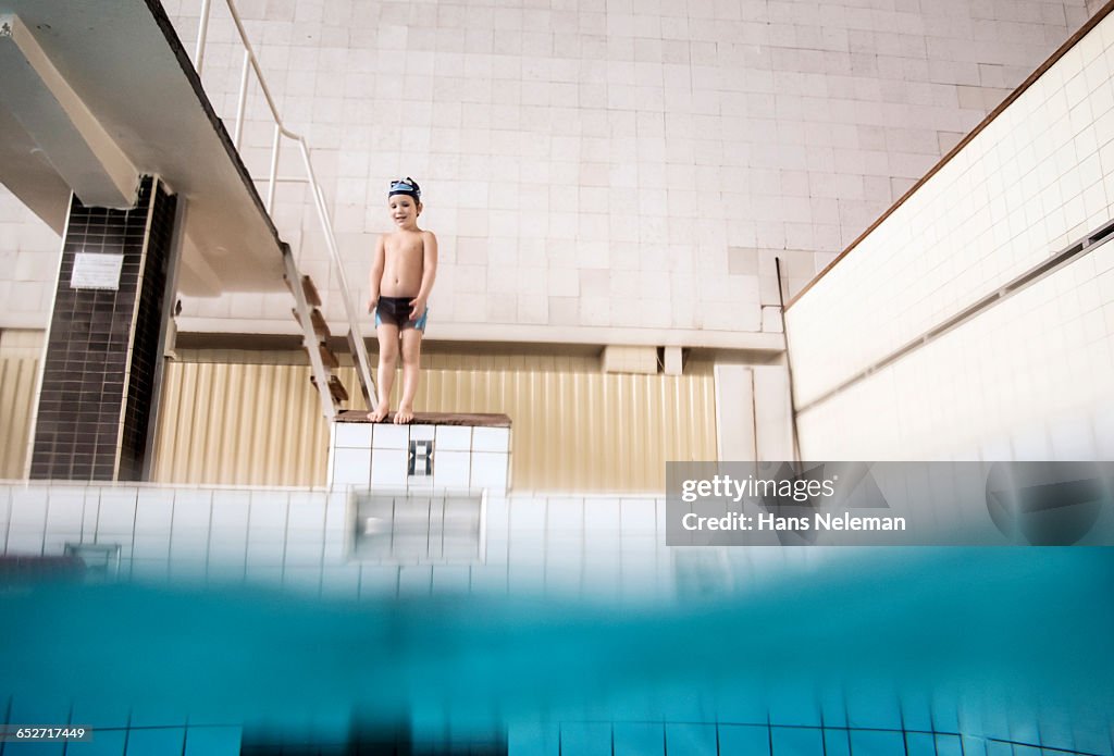 Boy preparing to pool dive