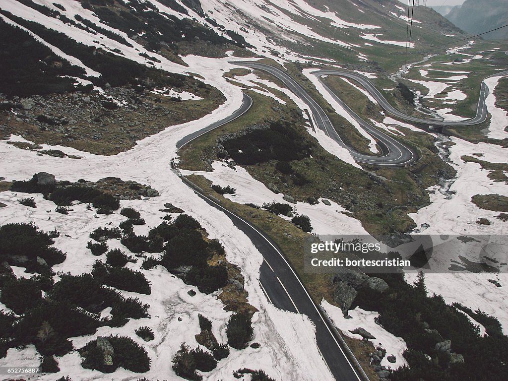 Scenic View Of Road Passing Through Mountains