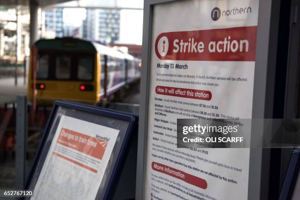 Poster in Manchester Victoria train station gives details of the reduced transport service due to industrial action taken by the RMT union in...