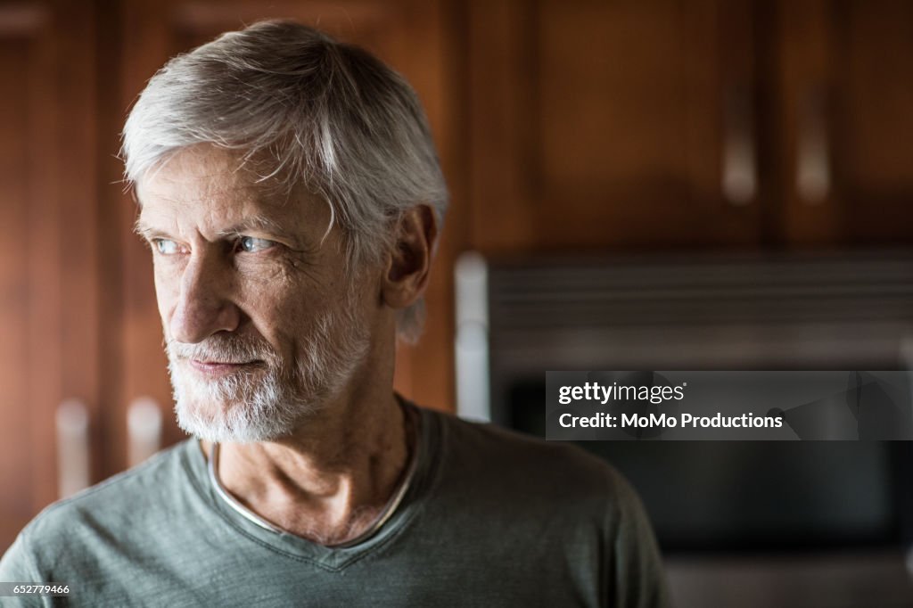Portrait of man (60yrs) at home
