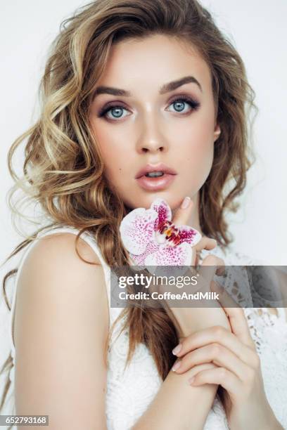 beautiful woman with flowers - wearing flowers stock pictures, royalty-free photos & images