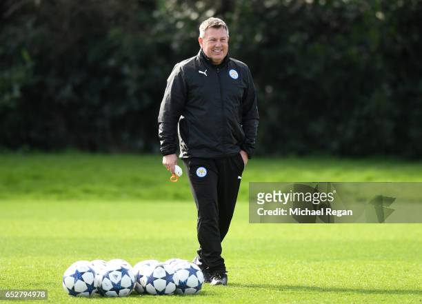 Craig Shakespeare, Manager of Leicester City watches the squad train during a Leicester City Training Session ahead of their UEFA Champions League...