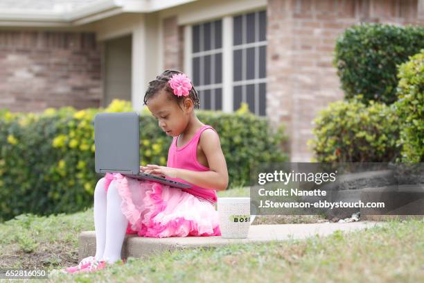 little girl wearing pink tutu with coffee and computer - nanette j stevenson stock pictures, royalty-free photos & images