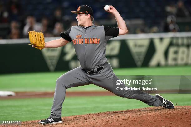 Pitcher Jim Ploeger of the Netherlands throws in the bottom of the seventh inning during the World Baseball Classic Pool E Game Three between...