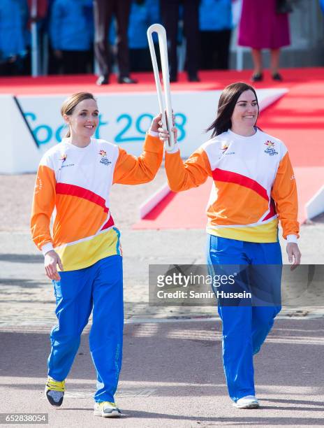 Anna Meares and Victoria Pendleton carry the Commonwealth baton at the launch of The Queen's Baton Relay for the XXI Commonwealth Games being held on...