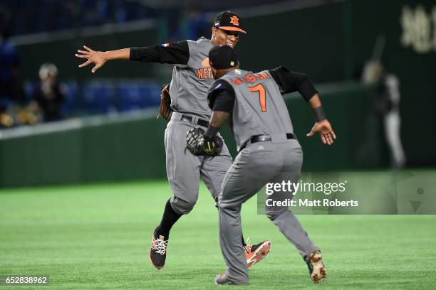 Infielder Yurendell de Caster and Infielder Xander Bogaerts of the Netherlands celebrate their 12-2 victory in the World Baseball Classic Pool E Game...