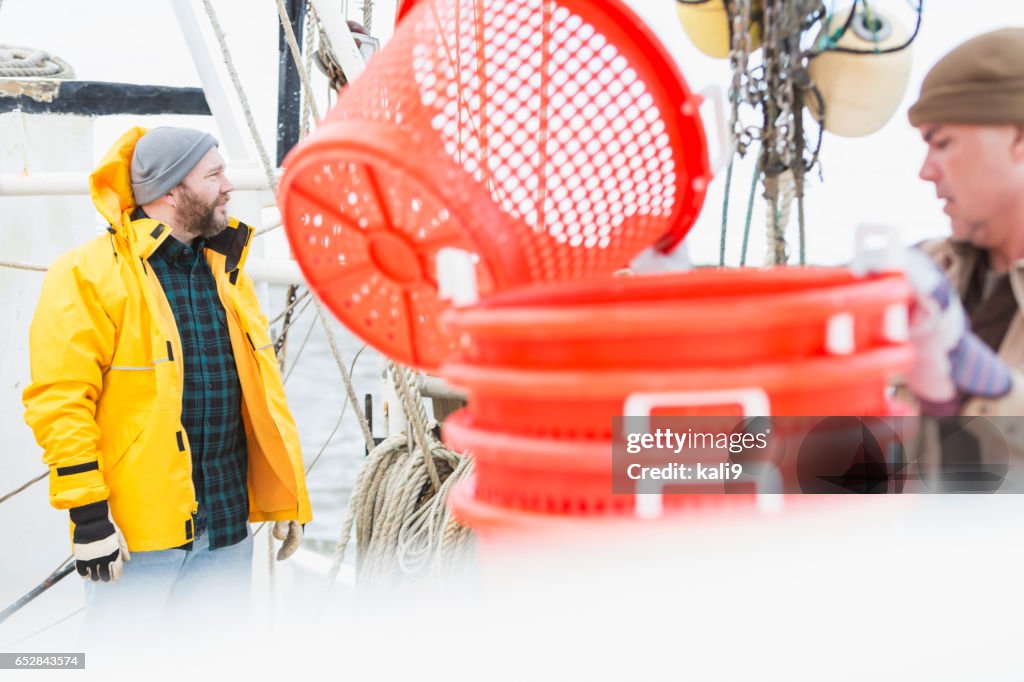 Men working on commercial fishing boat