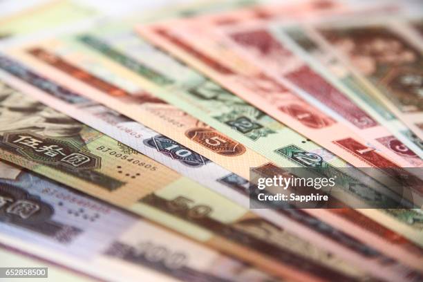 stack of chinese currency - gold abacus stock pictures, royalty-free photos & images