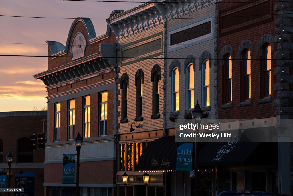 Sunset reflects off of buildings in Rogers, Arkansas