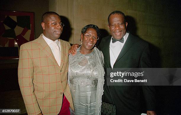 British artist and filmmaker Steve McQueen with his mother Mary McQueen and his father Philbert McQueen at the Turner Prize awards ceremony, held at...