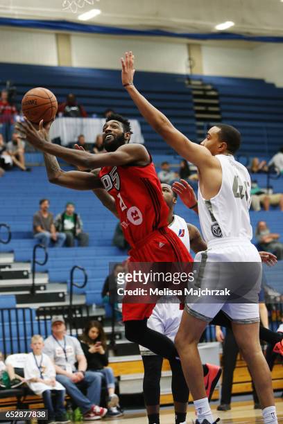 Leslie of the Raptors 905 goes up for the shot against Brandon Triche of the Salt Lake City Stars at Bruins Arena on March 10, 2017 in Taylorsville,...