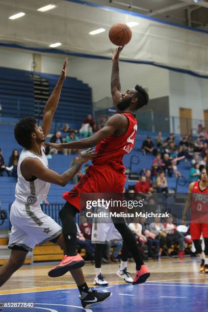 Leslie of the Raptors 905 goes for the shot over Tyrone Wallace of the Salt Lake City Stars at Bruins Arena on March 10, 2017 in Taylorsville, Utah....