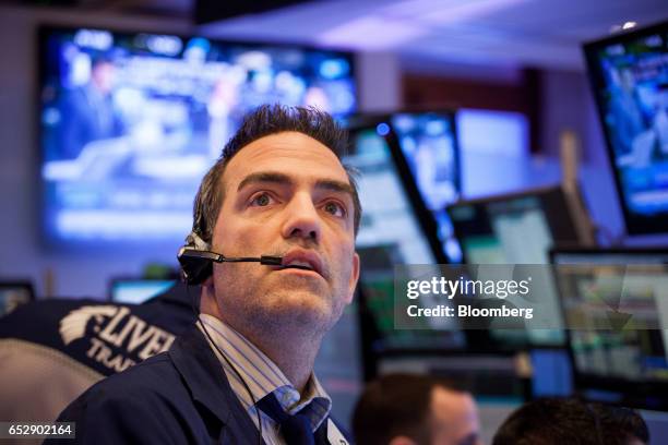 Trader works on the floor of the New York Stock Exchange in New York, U.S., on Monday, March 13, 2017. U.S. Stocks held steady as they kicked off a...