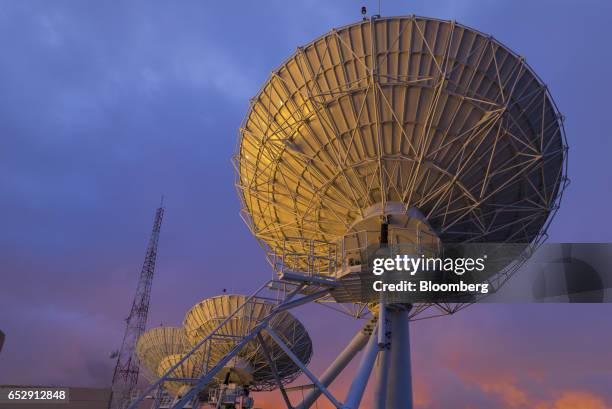 Satellite antennas stand at the Bolivian Space Agency Amachuma Ground Station at sunset in Achocalla, La Paz Department, Bolivia, on Wednesday, March...