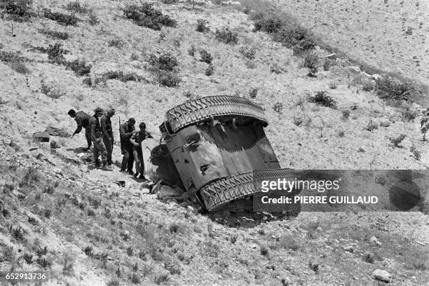Israeli soldiers check a destroyed tank near the road between Bethleem and Jerusalem, in June 1967 during the 1967 Arab-Israeli war. On June 5 Israel...