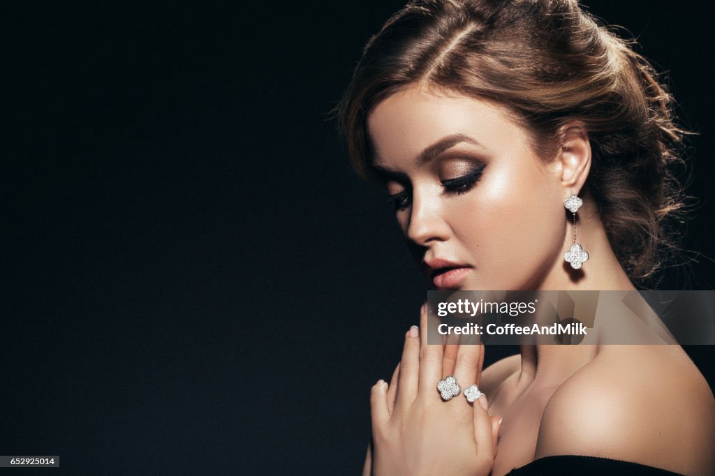 Horizontal portrait of a beautiful girl with shiny jewelry