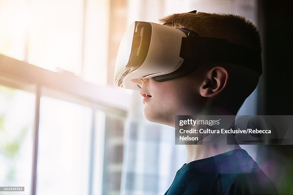 Boy wearing virtual reality headset